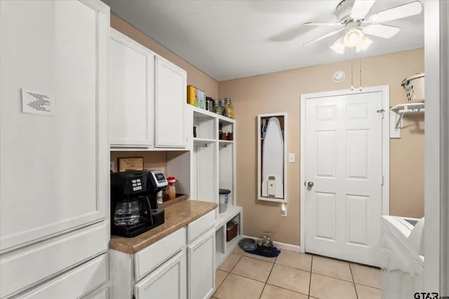 a kitchen with stainless steel appliances a refrigerator and cabinets