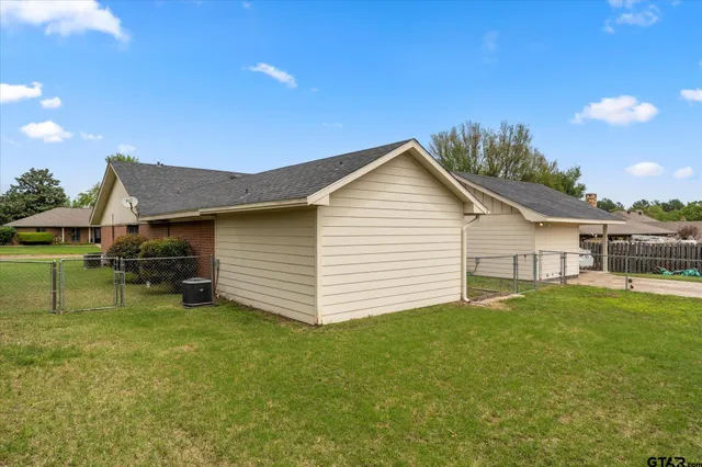 a view of a backyard with a sitting area and fire pit