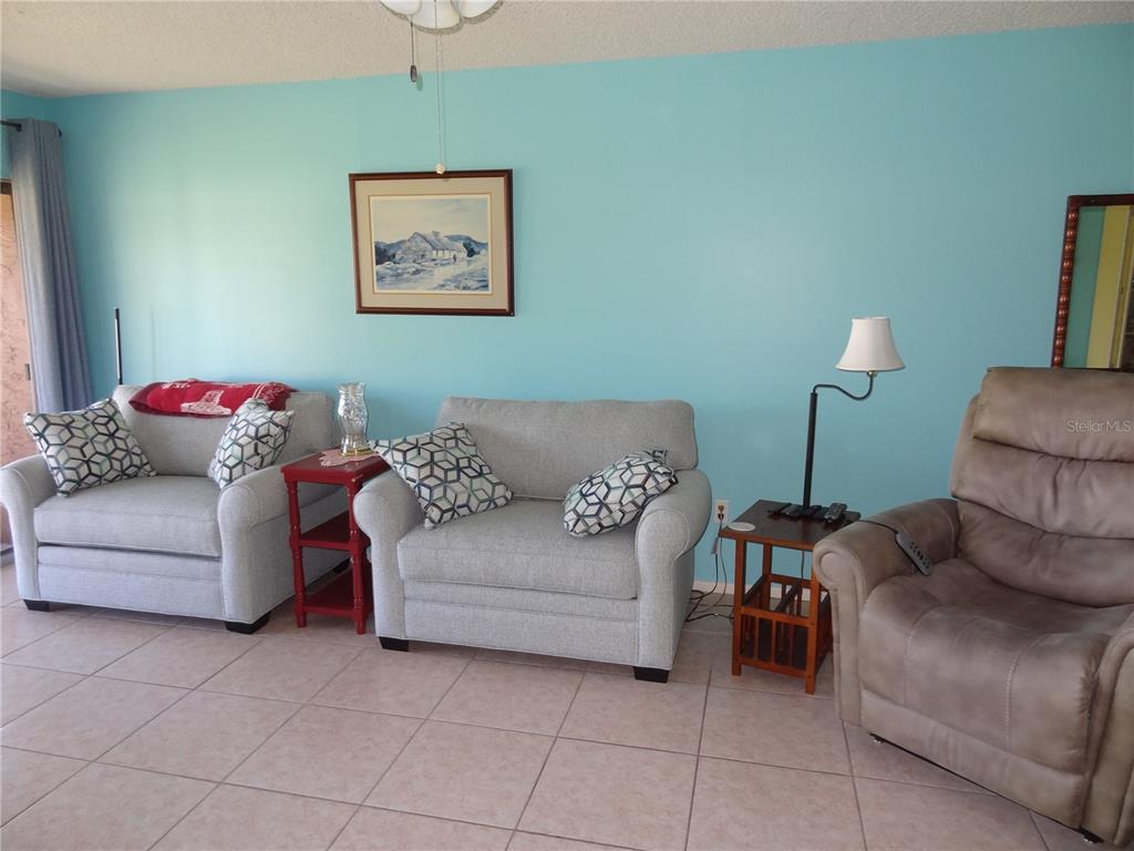 11135 Carriage Hill Drive, Unit 3 Port Richey, FL 34668 - Photo 12 of 25 a living room with furniture and a couch