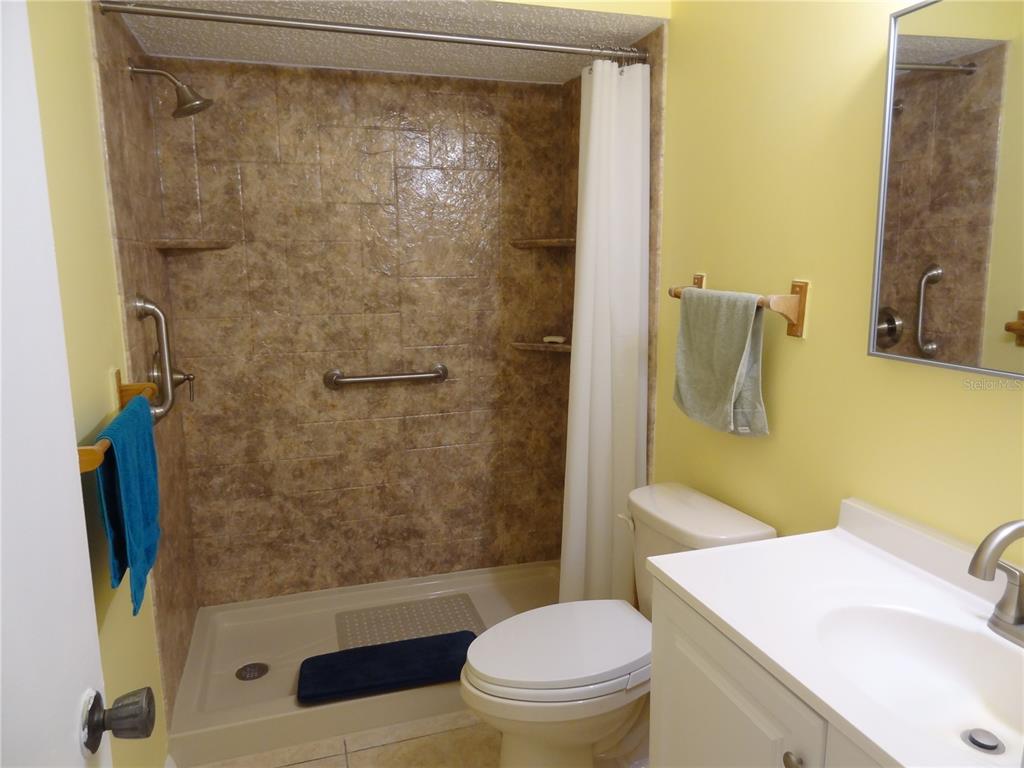 11135 Carriage Hill Drive, Unit 3 Port Richey, FL 34668 - Photo 19 of 25 a bathroom with a sink and a mirror