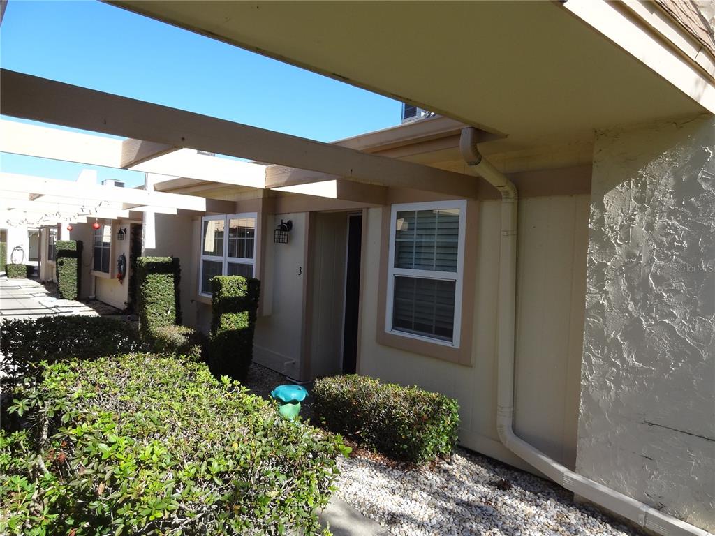 11135 Carriage Hill Drive, Unit 3 Port Richey, FL 34668 - Photo 2 of 25 a room with garden