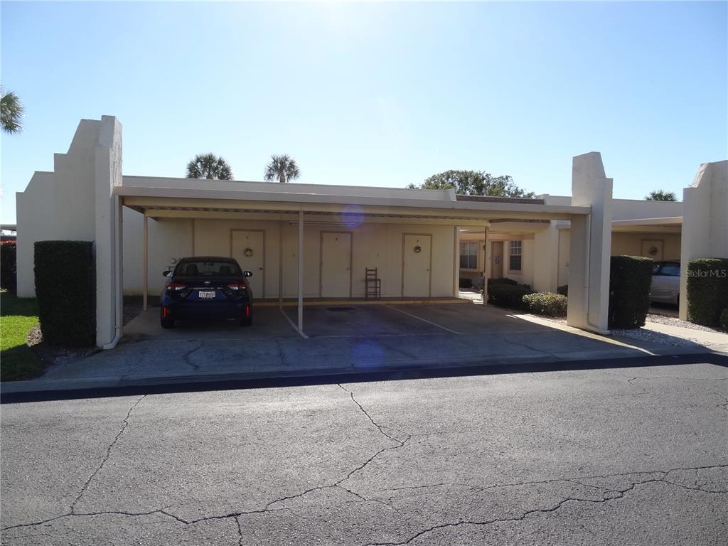 11135 Carriage Hill Drive, Unit 3 Port Richey, FL 34668 - Photo 21 of 25 a view of the house and outdoor space