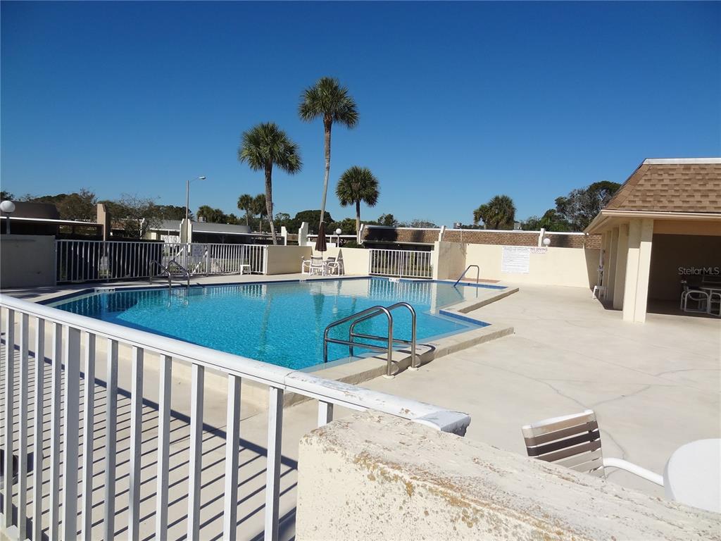 11135 Carriage Hill Drive, Unit 3 Port Richey, FL 34668 - Photo 24 of 25 a view of kitchen and living room