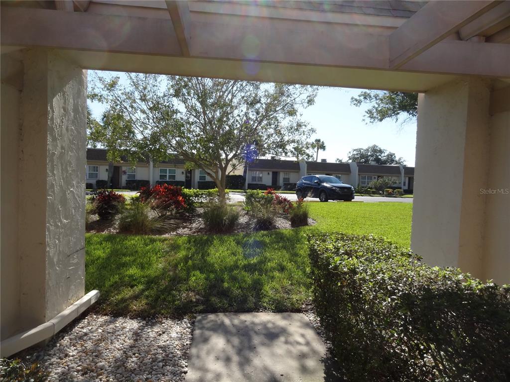 11135 Carriage Hill Drive, Unit 3 Port Richey, FL 34668 - Photo 4 of 25 a view of a back yard