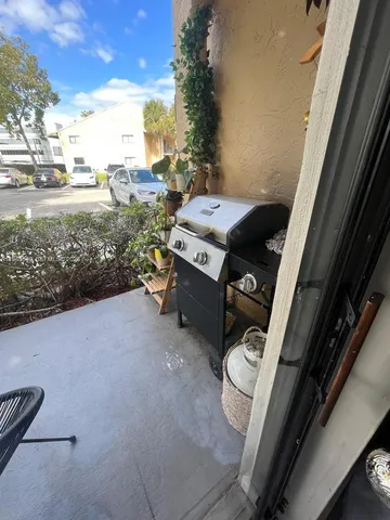 a view of barbeque area with seating area