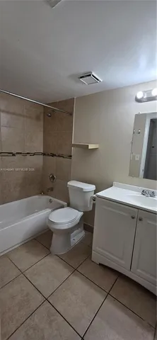 a bathroom with a toilet a sink and bathtub