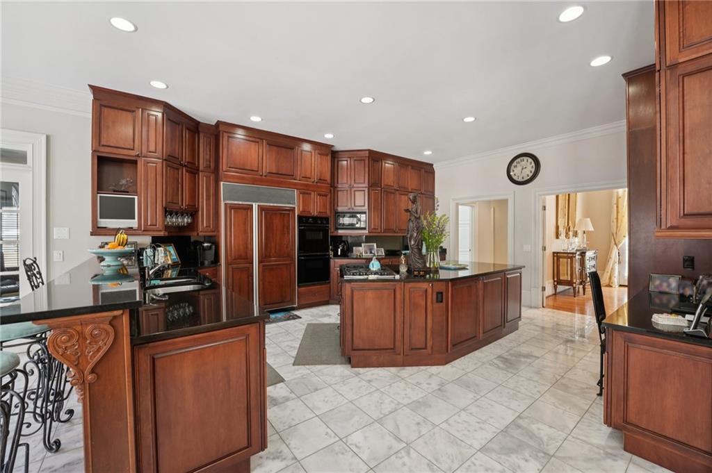 1296 Niskey Lake Road Southwest Atlanta, GA 30331 - Photo 19 of 88 a kitchen with stainless steel appliances granite countertop a refrigerator a sink and a stove