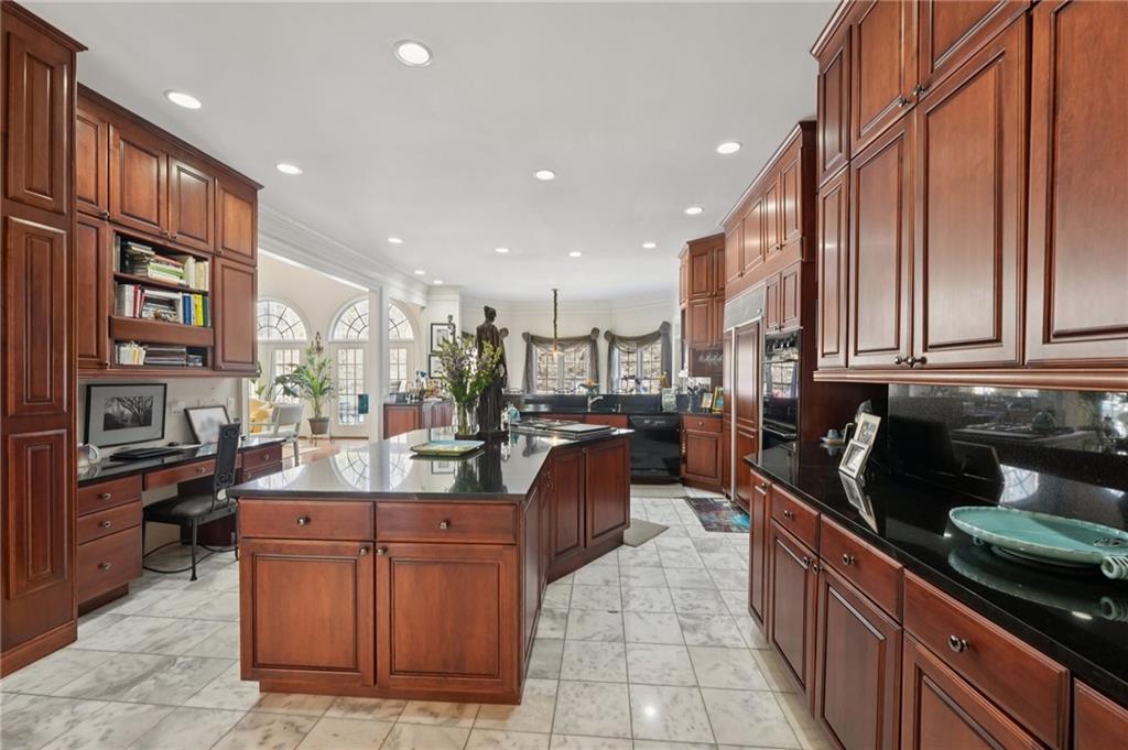 1296 Niskey Lake Road Southwest Atlanta, GA 30331 - Photo 21 of 88 a kitchen with stainless steel appliances kitchen island granite countertop a stove and cabinets