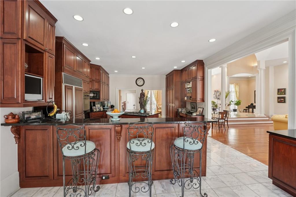 1296 Niskey Lake Road Southwest Atlanta, GA 30331 - Photo 23 of 88 a kitchen with stainless steel appliances granite countertop a stove and cabinets