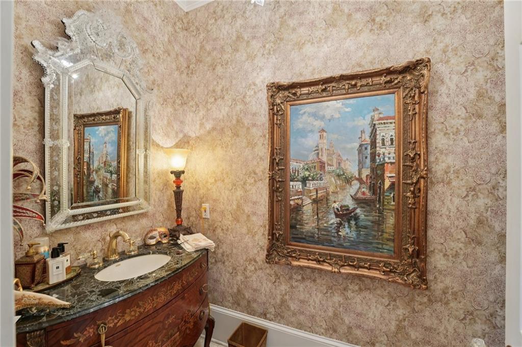 1296 Niskey Lake Road Southwest Atlanta, GA 30331 - Photo 36 of 88 a bathroom with a granite countertop sink a mirror and shower