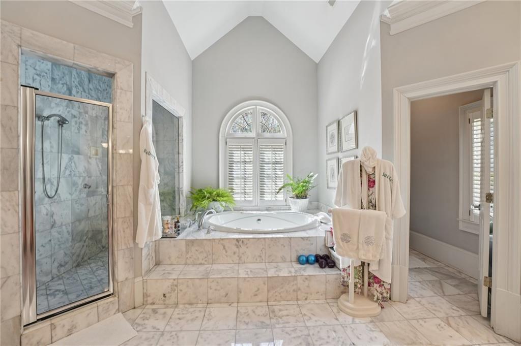 1296 Niskey Lake Road Southwest Atlanta, GA 30331 - Photo 42 of 88 a spacious bathroom with a tub shower and window