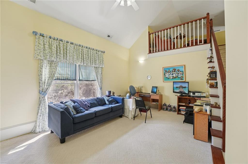 1296 Niskey Lake Road Southwest Atlanta, GA 30331 - Photo 43 of 88 a living room with furniture and a flat screen tv