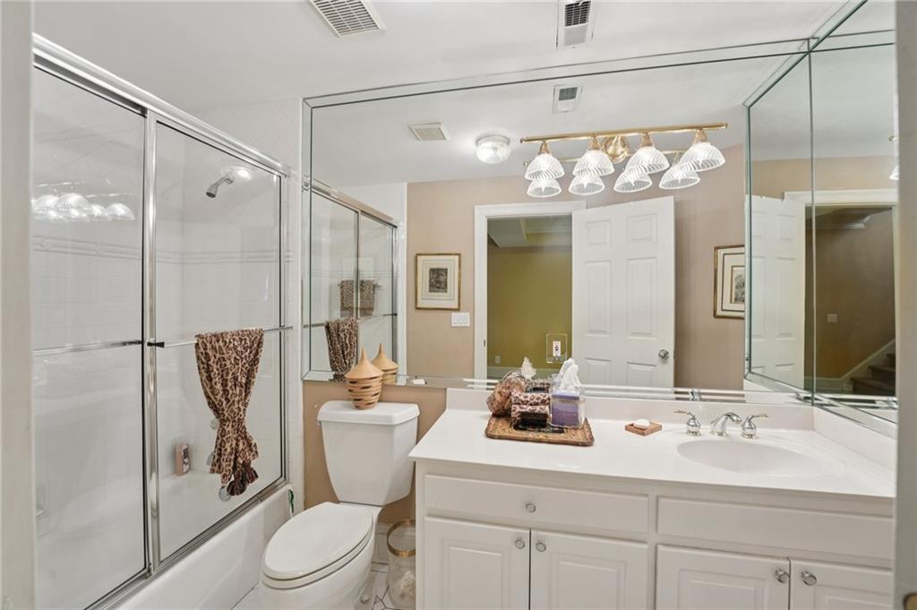 1296 Niskey Lake Road Southwest Atlanta, GA 30331 - Photo 47 of 88 a bathroom with a sink a toilet and shower