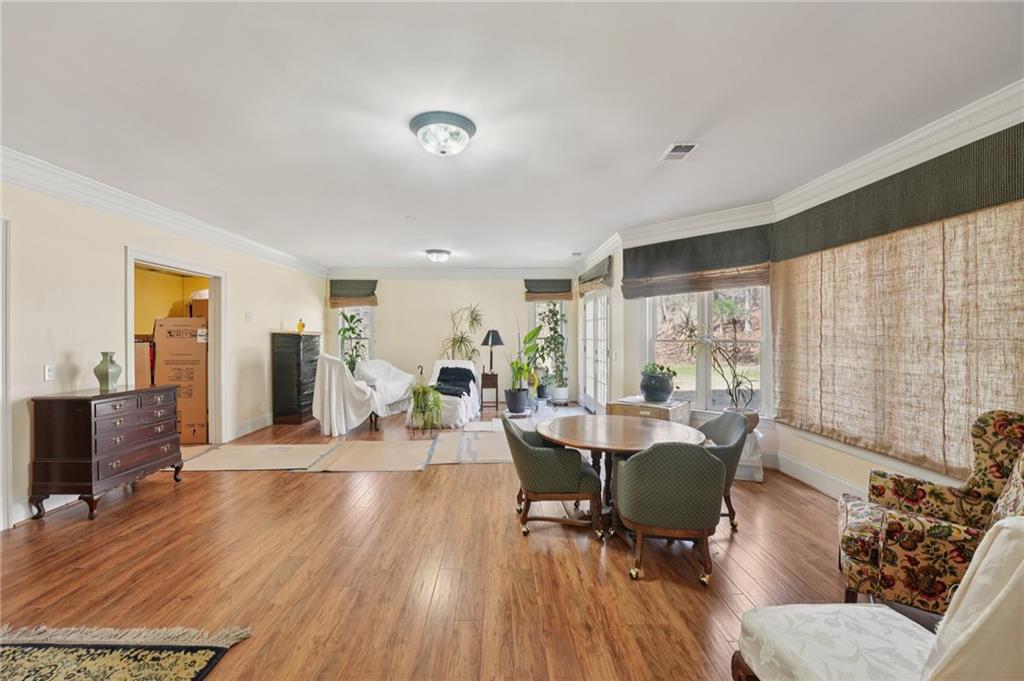 1296 Niskey Lake Road Southwest Atlanta, GA 30331 - Photo 60 of 88 a view of a dining room with furniture window and wooden floor
