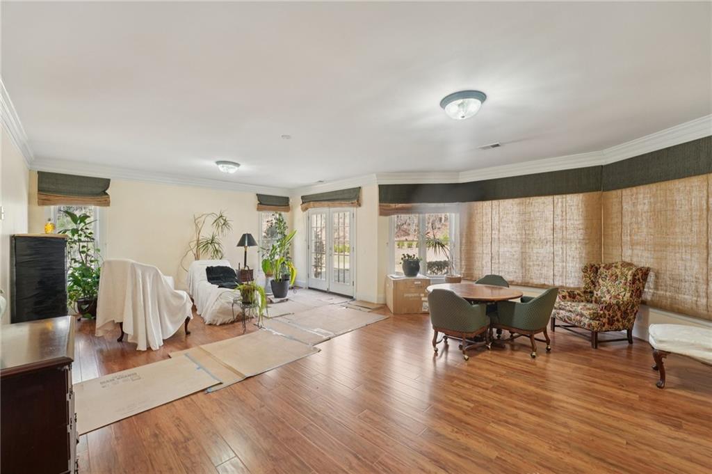 1296 Niskey Lake Road Southwest Atlanta, GA 30331 - Photo 61 of 88 a view of a dining room with furniture window and wooden floor