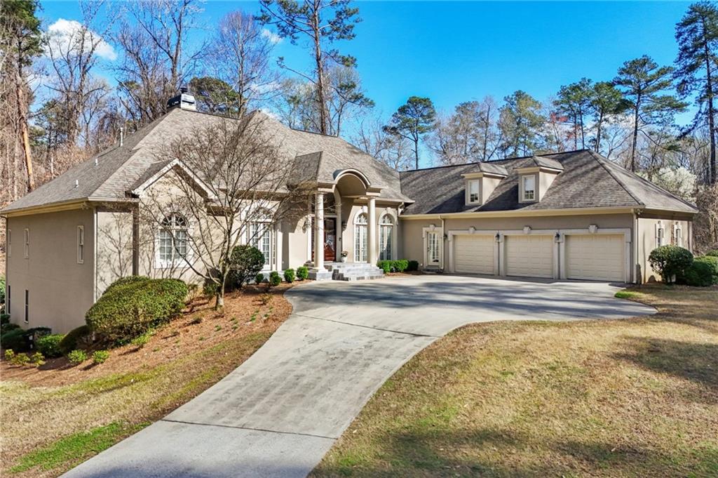 1296 Niskey Lake Road Southwest Atlanta, GA 30331 - Photo 77 of 88 a front view of a house with a yard and garage