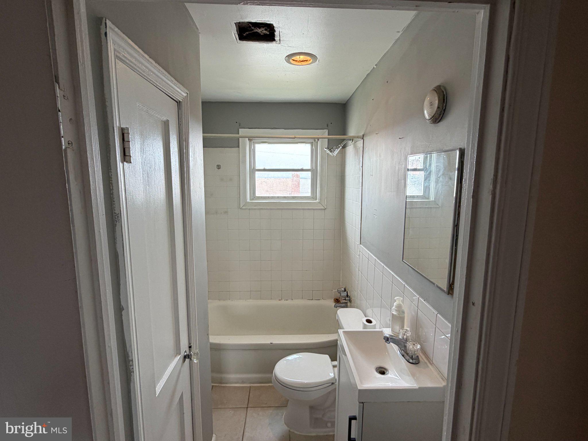 7216 Conley Street Baltimore, MD 21224 - Photo 8 of 14 Bright and functional bathroom space.