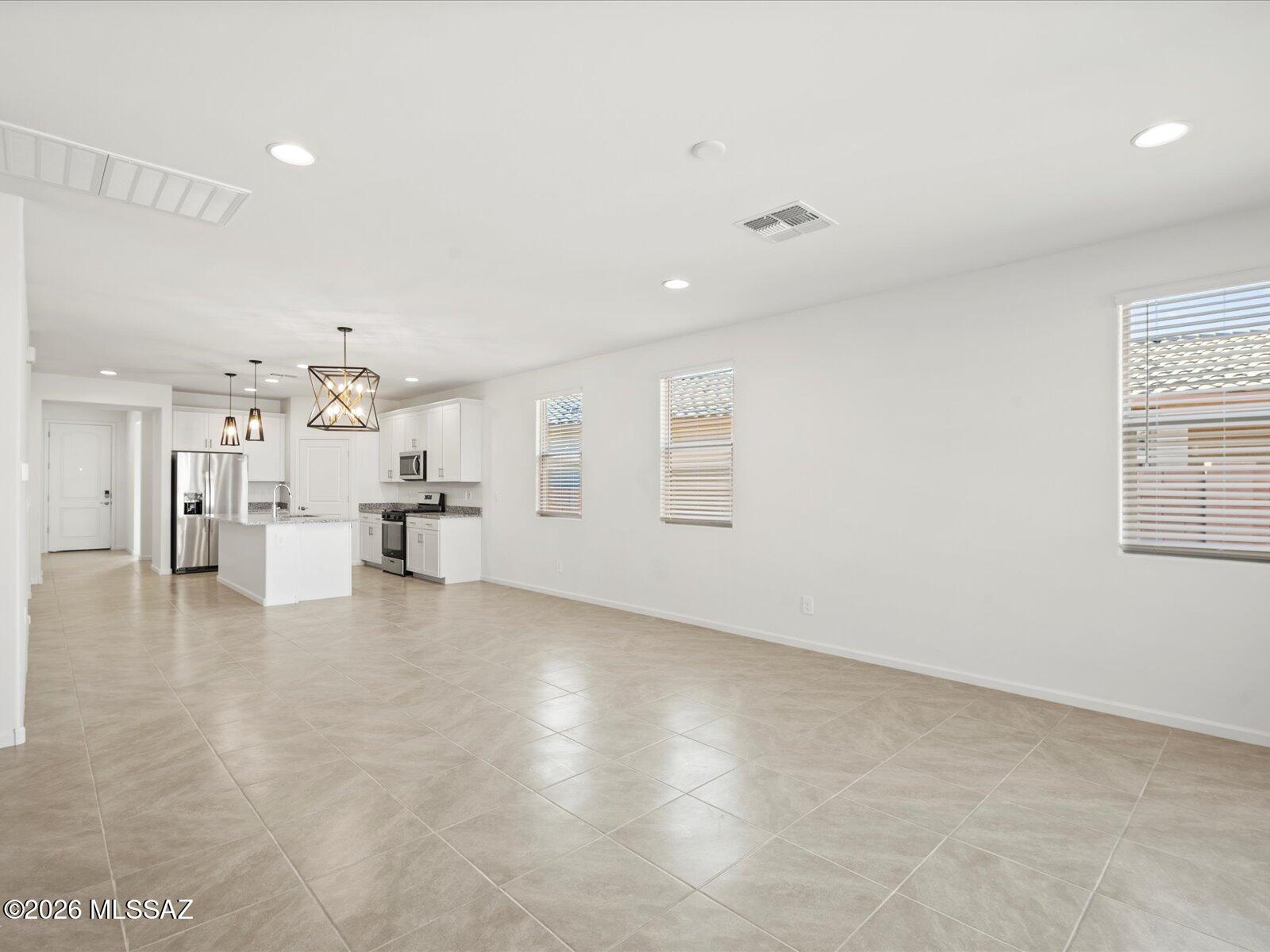 5134 West Bowen House Road Tucson, AZ 85757 - Photo 12 of 14 Photos shown are of a similar floor plan and are intended to provide a close representation of the actual home. Images may include features, finishes, countertops, fixtures, flooring, cabinets, color of cabinets, furnishings, or decorator elements that are not part of the standard offering. While this specific home may include some of these features, please note it may not include all.
