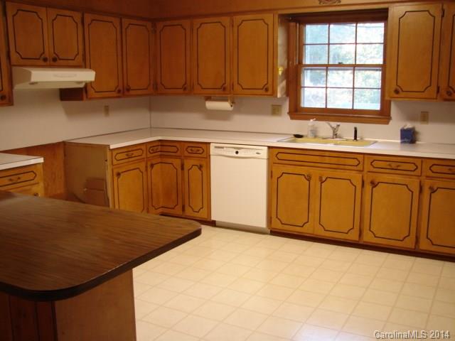 147 Ashbrook Rd Point, Unit 27 Statesville, NC 28677 - Photo 17 of 24 a kitchen with stainless steel appliances granite countertop a sink a stove cabinets and a window