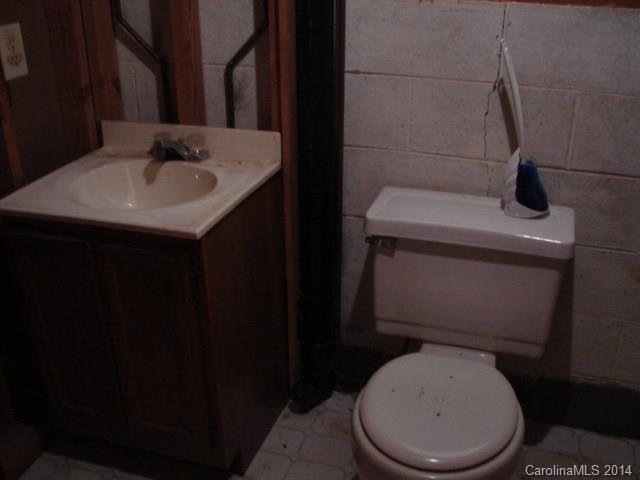 147 Ashbrook Rd Point, Unit 27 Statesville, NC 28677 - Photo 20 of 24 a white toilet sitting next to a bathroom sink
