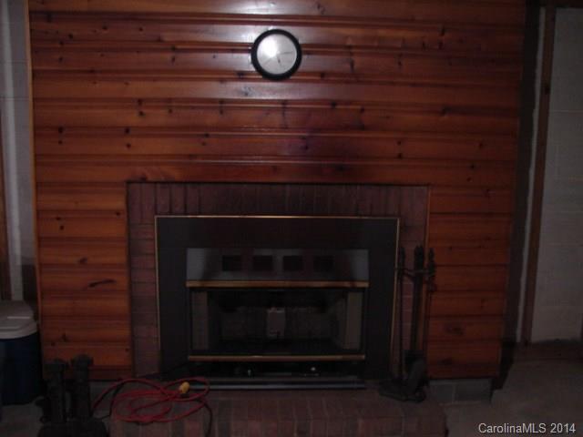 147 Ashbrook Rd Point, Unit 27 Statesville, NC 28677 - Photo 24 of 24 a living room with a wooden floor and a fireplace
