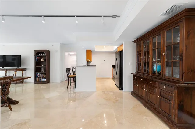 a view of a livingroom with furniture and a flat screen tv