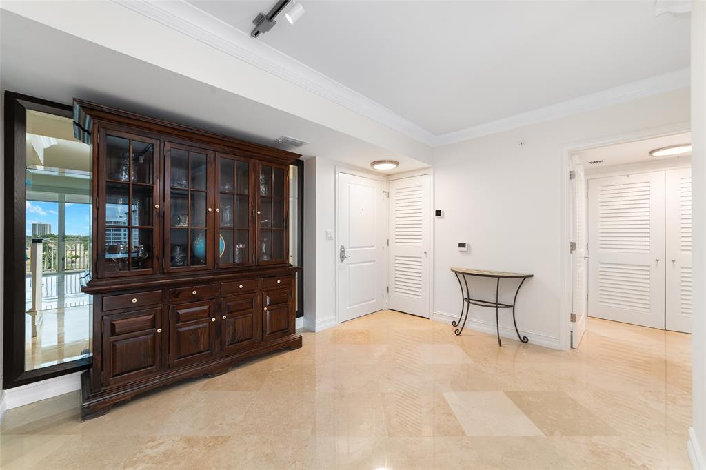 99 Southeast Mizner Boulevard, Unit 603 Boca Raton, FL 33432 - Photo 26 of 34 a room with a dresser and a window