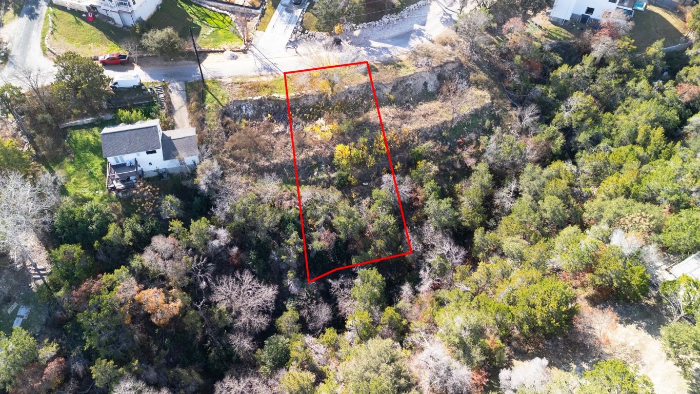 14504 Hunters Pass Austin, TX 78734 - Photo 13 of 19 a view of a house with a yard and garden