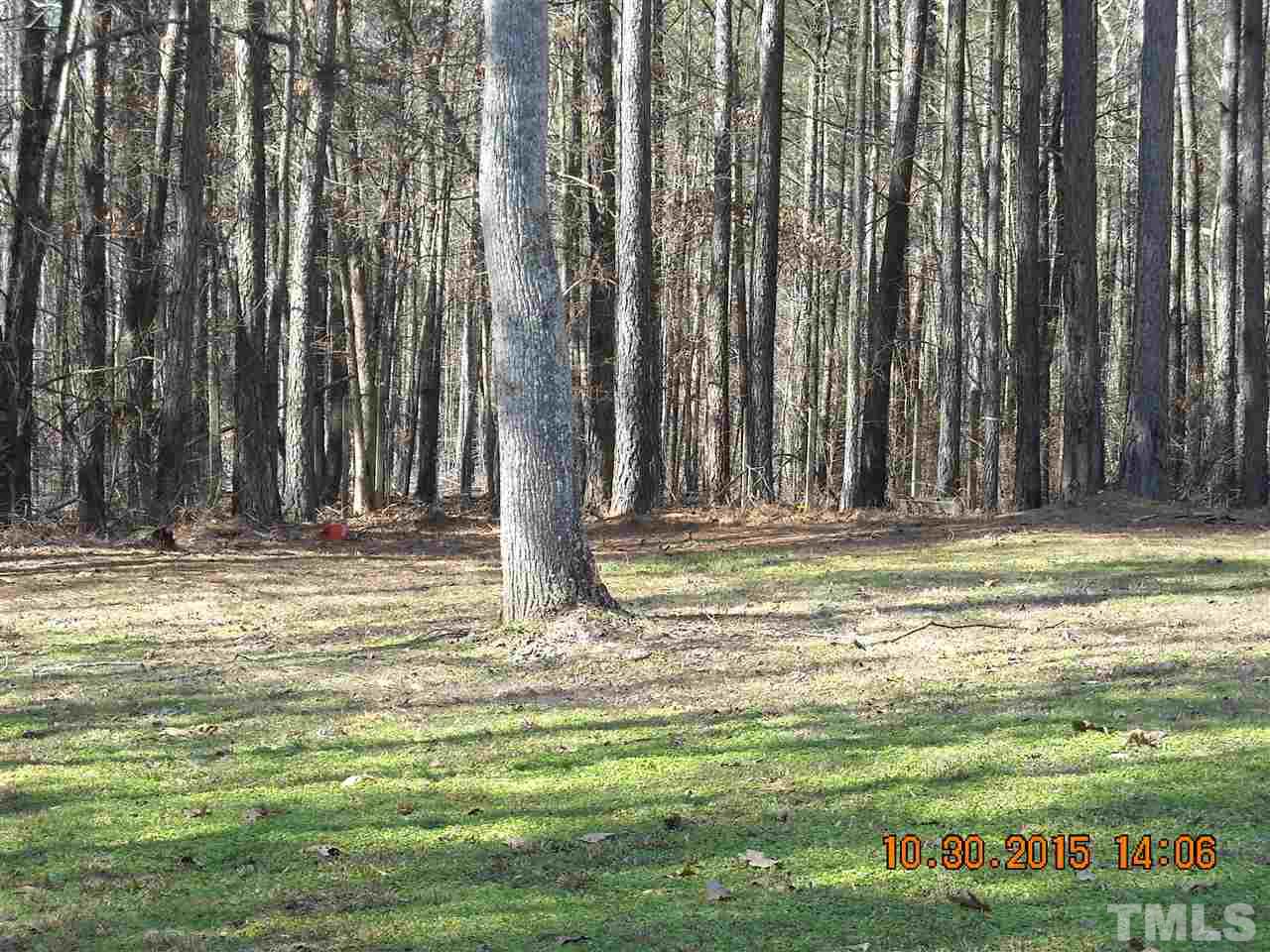 2572 Courtney Road Oxford, NC 27565 - Photo 3 of 25 a swimming pool with trees in the background