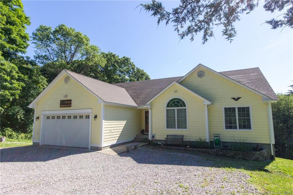 187 Miller Road Preston, CT 06365 - Photo 1 of 1 a front view of a house with a yard and garage