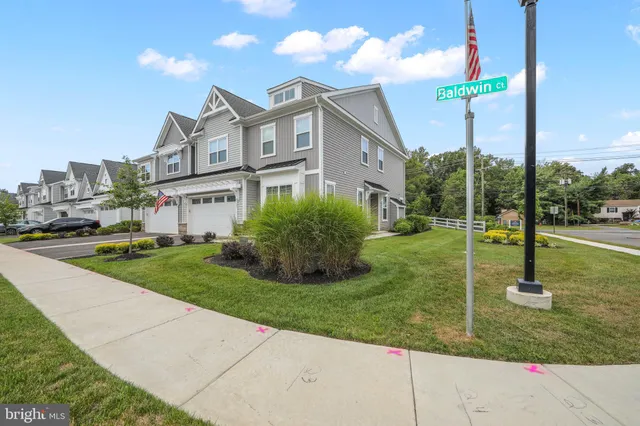 a view of a street with a building in the background