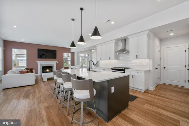 a open kitchen with sink cabinets and wooden floor