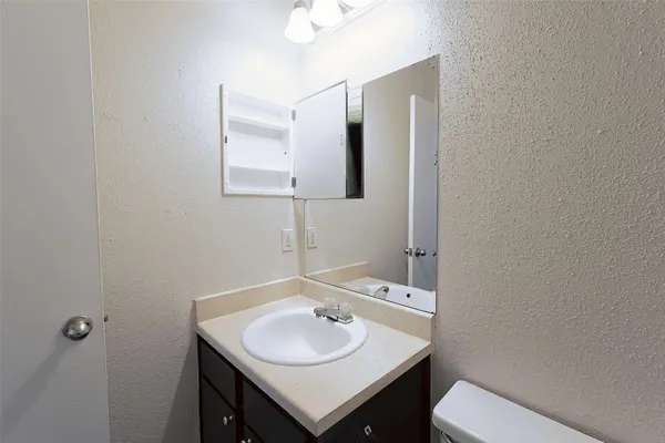 a bathroom with a sink and a toilet