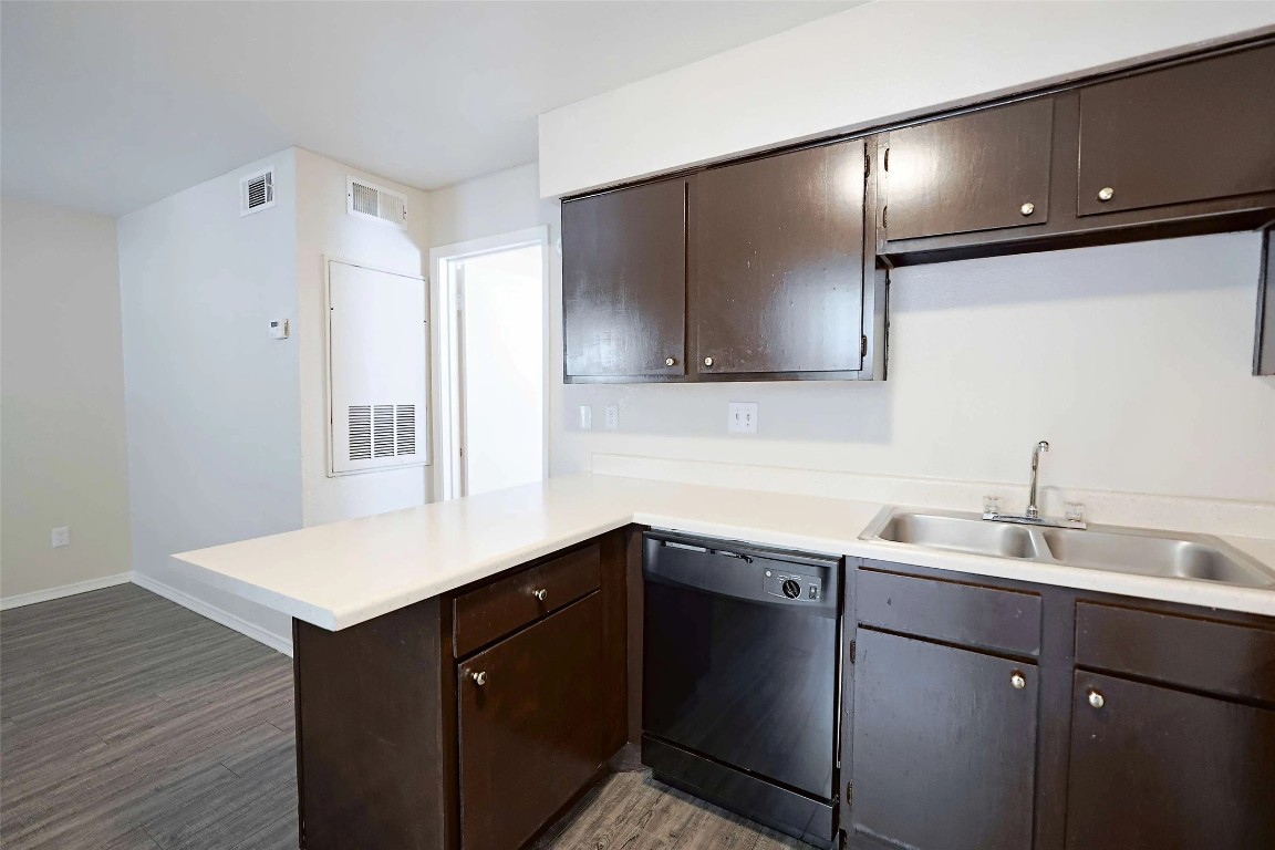 2809 West William Cannon Drive, Unit I101 Austin, TX 78745 - Photo 3 of 29 a kitchen with a sink cabinets and a window