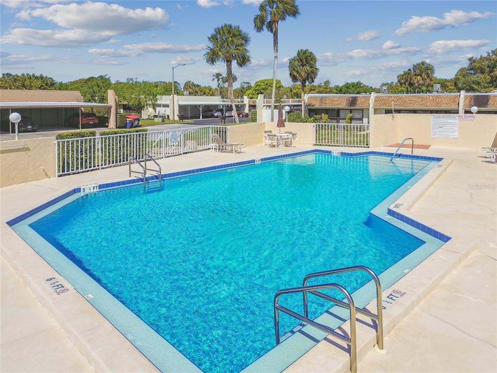 11340 Carriage Hill Drive, Unit 4 Port Richey, FL 34668 - Photo 24 of 36 a view of a balcony with chairs