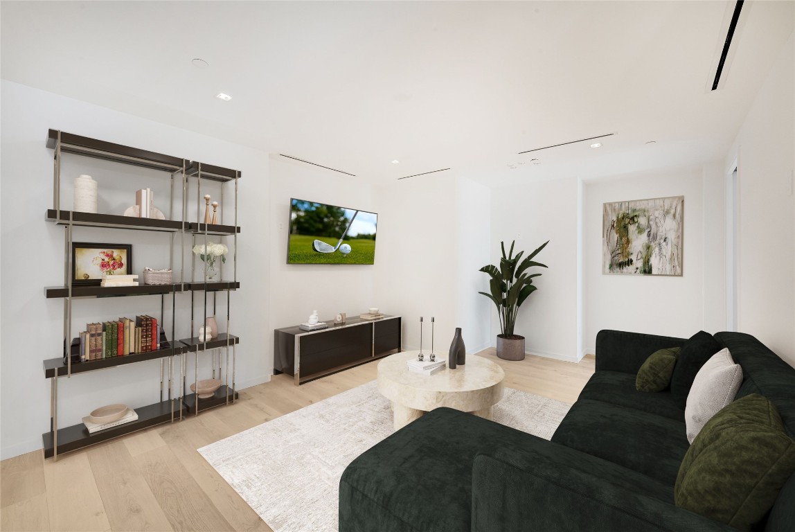 1006 Baylor Street, Unit 202 Austin, TX 78703 - Photo 8 of 23 a living room with furniture and a flat screen tv