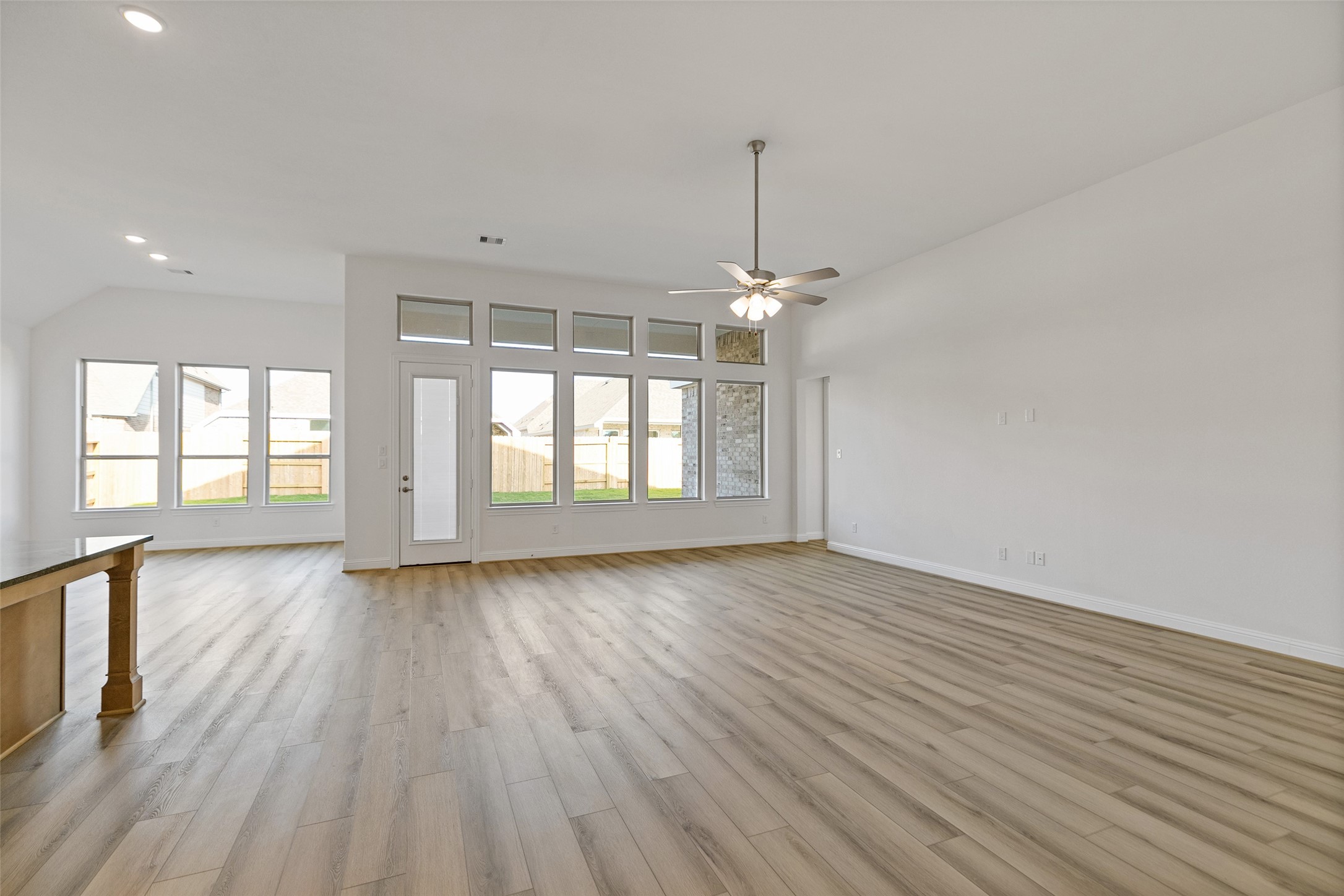 523 Blue River Trail Rosenberg, TX 77471 - Photo 12 of 34 a view of an empty room with wooden floor and a window