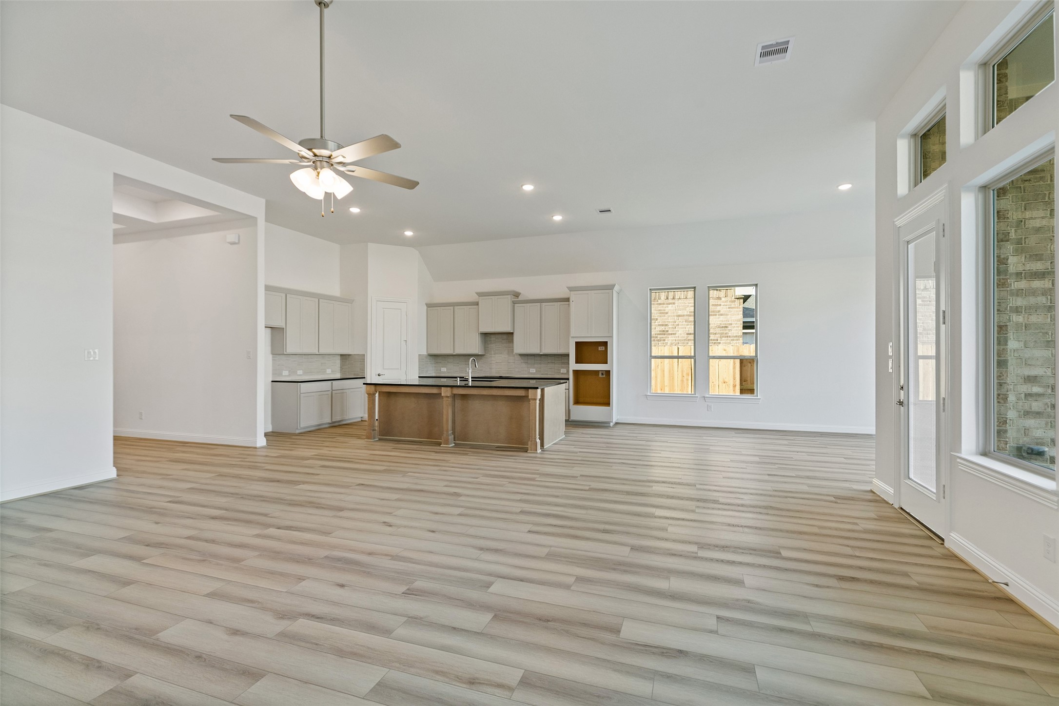 523 Blue River Trail Rosenberg, TX 77471 - Photo 14 of 34 a view of kitchen with wooden floor and window