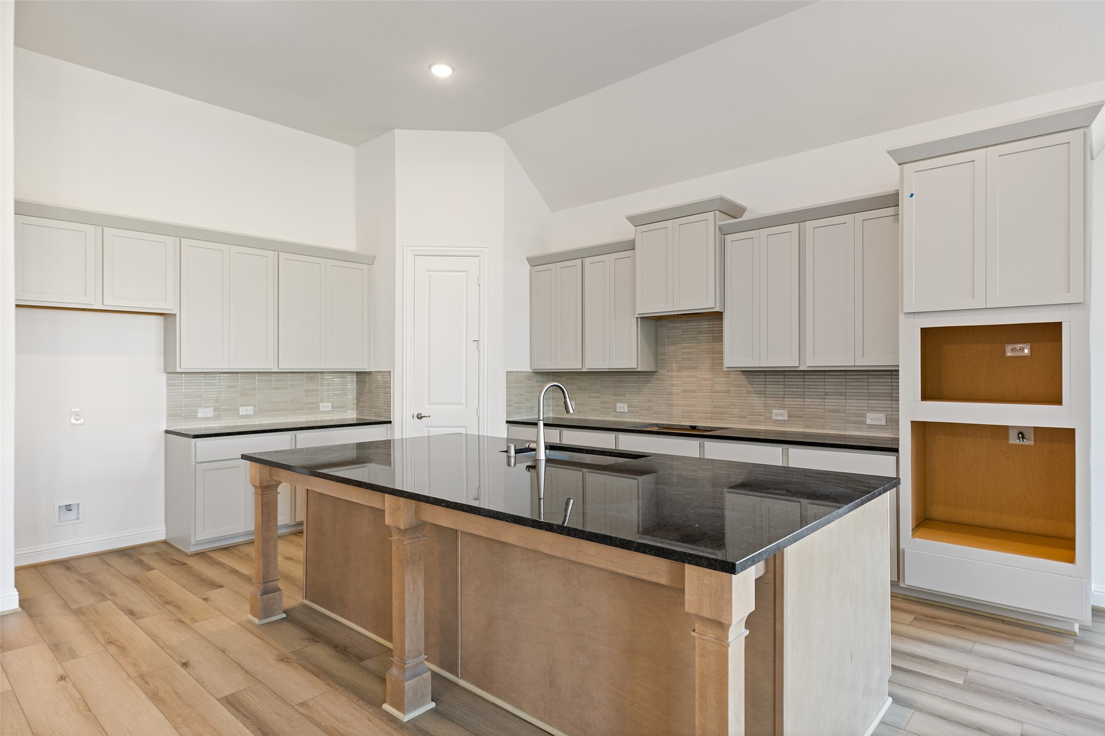 523 Blue River Trail Rosenberg, TX 77471 - Photo 18 of 34 a kitchen with granite countertop a sink stove and refrigerator