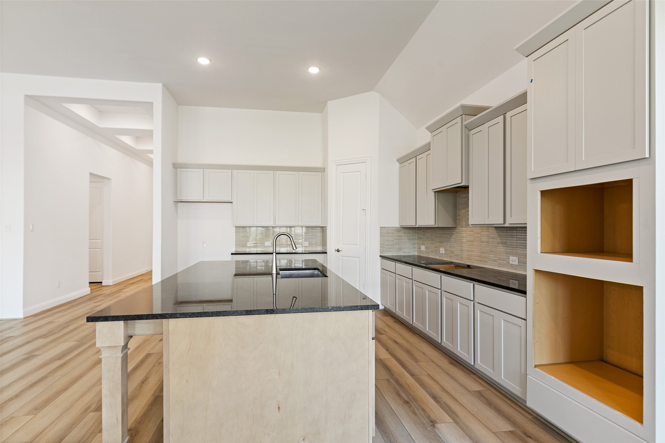 523 Blue River Trail Rosenberg, TX 77471 - Photo 20 of 34 a kitchen with stainless steel appliances granite countertop a sink a stove and a refrigerator