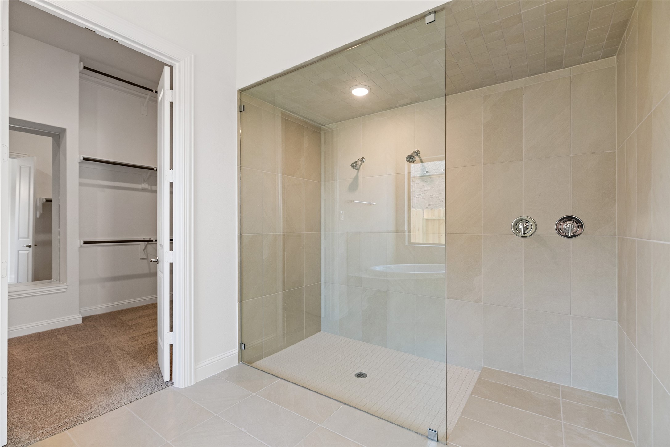 523 Blue River Trail Rosenberg, TX 77471 - Photo 28 of 34 a bathroom with a glass shower door