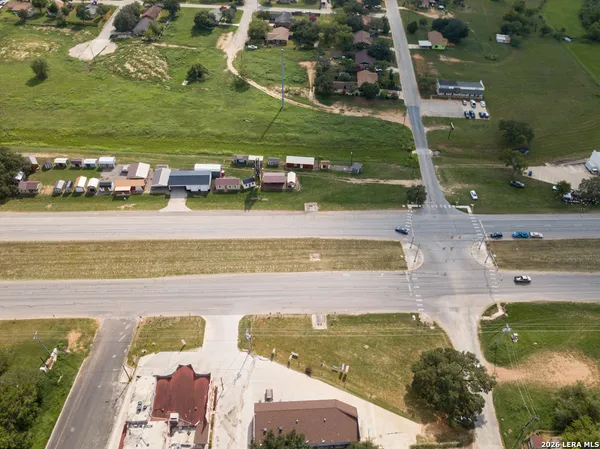 an aerial view of a residential houses with outdoor space
