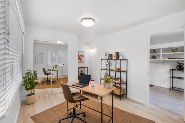a view of a livingroom with furniture and wooden floor