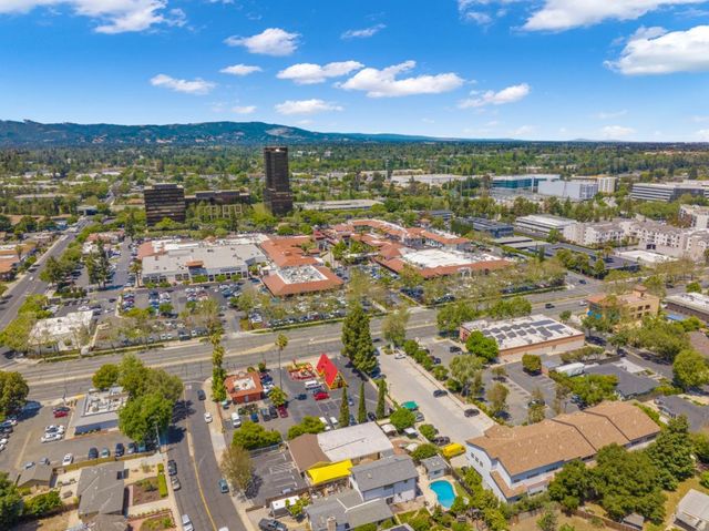 an aerial view of a house with outdoor space and street view