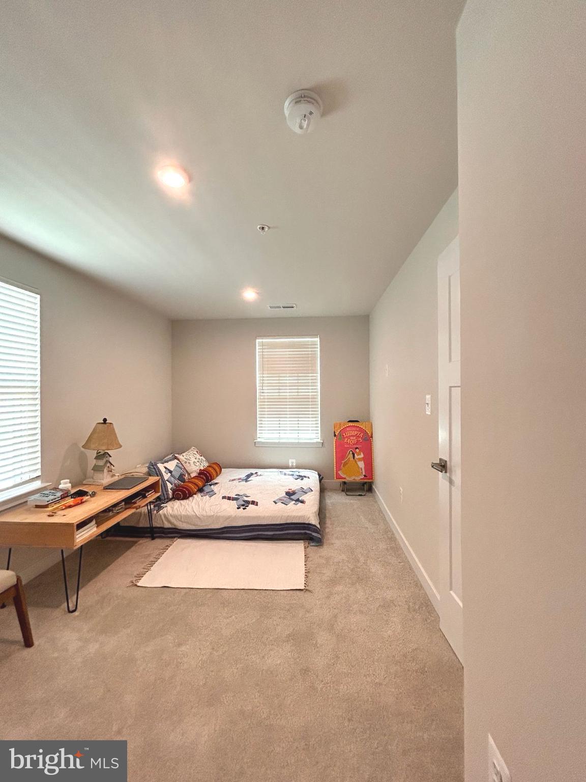 16225 Picasso Place Bowie, MD 20716 - Photo 14 of 19 a living room with furniture and a table