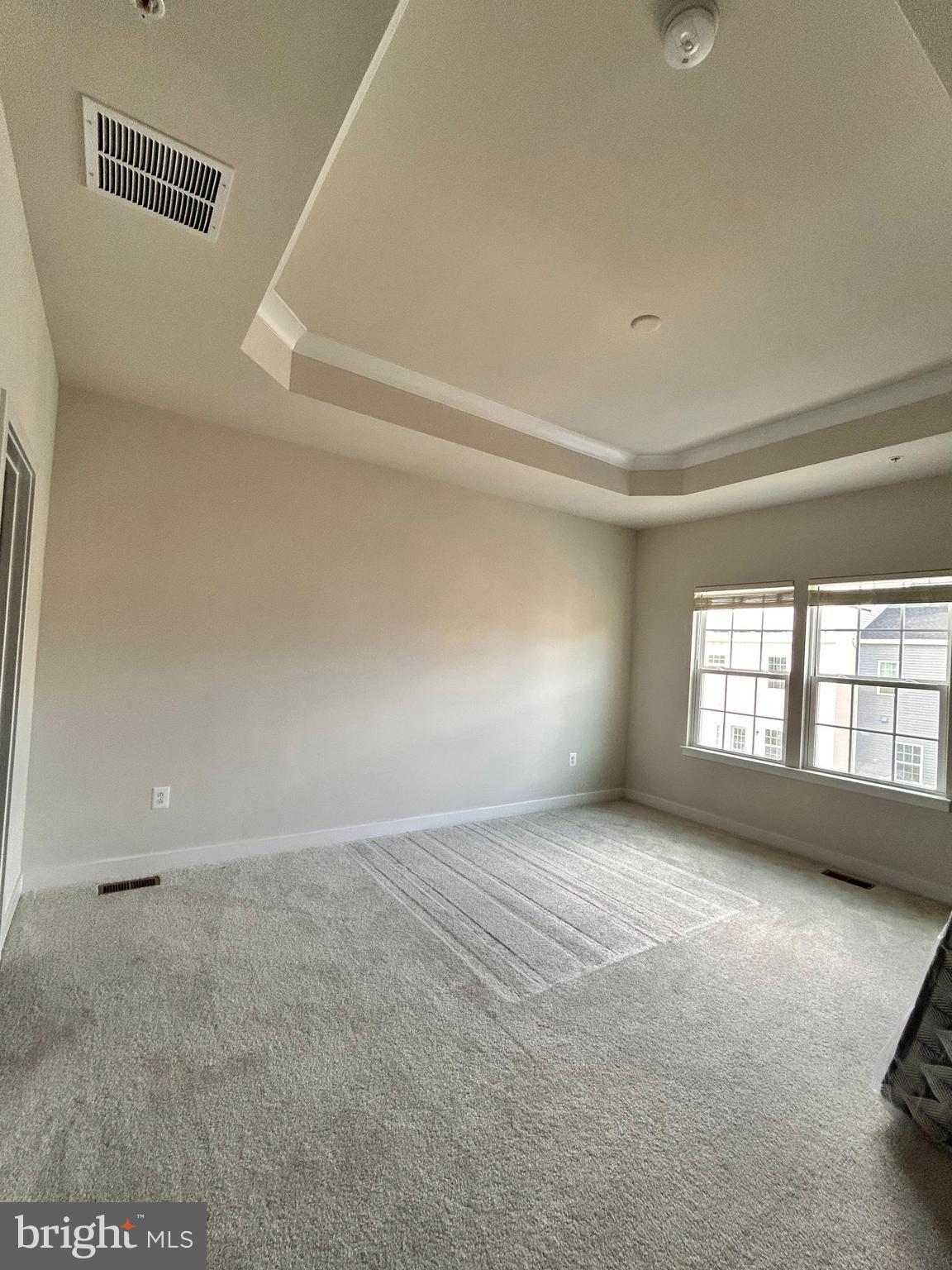 16225 Picasso Place Bowie, MD 20716 - Photo 10 of 19 a view of an empty room with a window