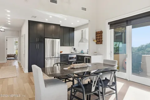 a outdoor living room with a couch and potted plant