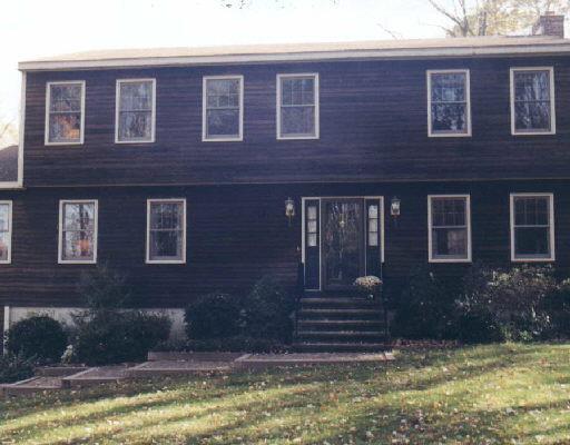 29 Meadow Brook Road Newtown, CT 06470 - Photo 1 of 1 a front view of a house with a yard