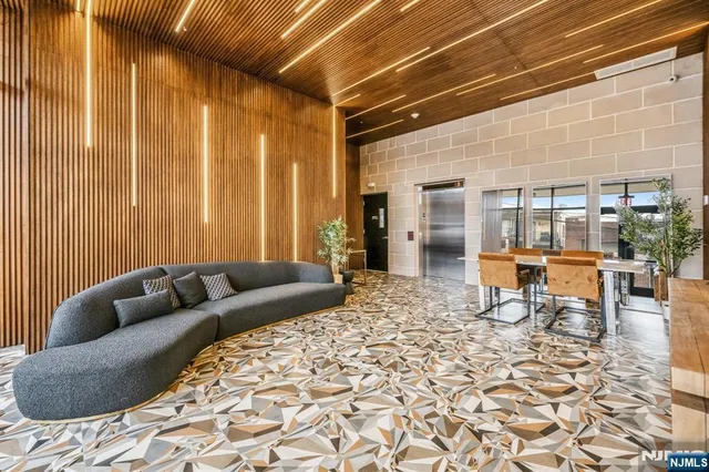 a living room with furniture and a rug