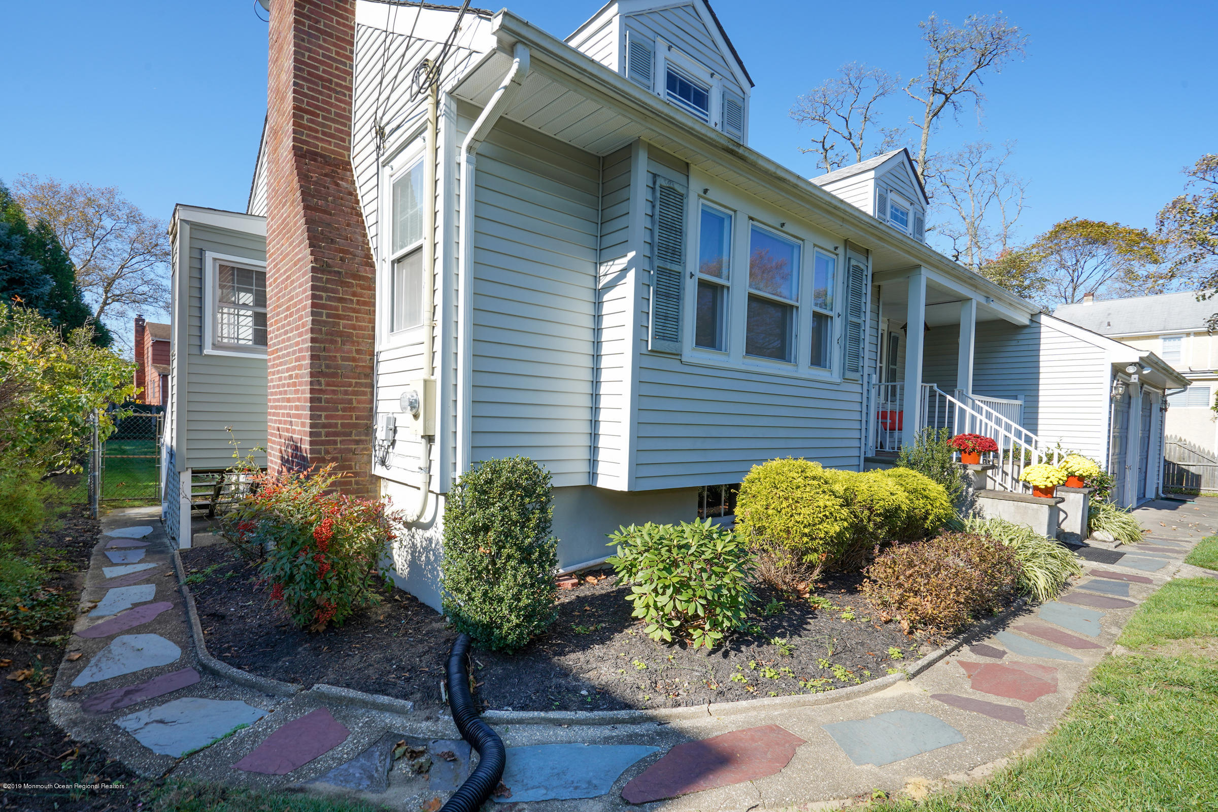 230 Oakhurst Road Oakhurst, NJ 07755 - Photo 5 of 31 a front view of a house with garden
